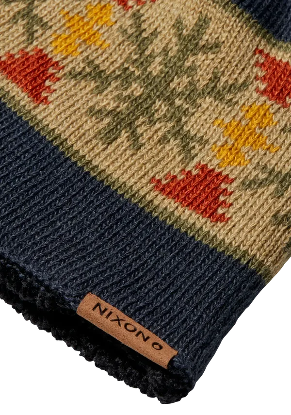 Close-up of a multicolour knitted pattern and a sewn brand tab
