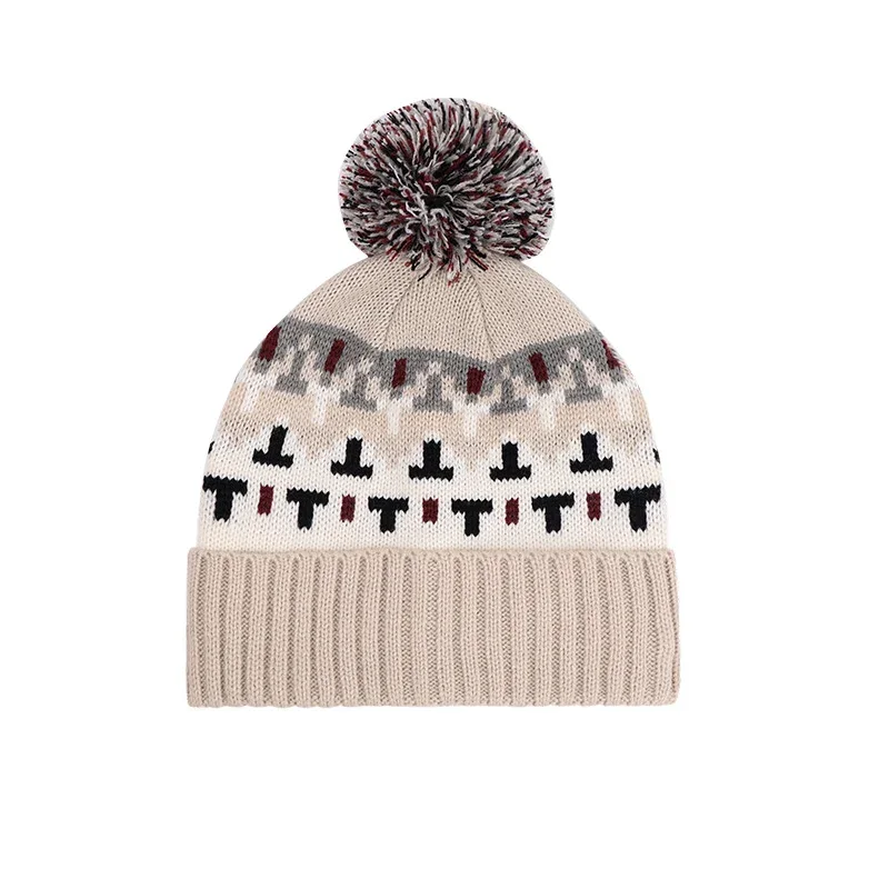 Cream patterned knitted beanie finished with pom-pom