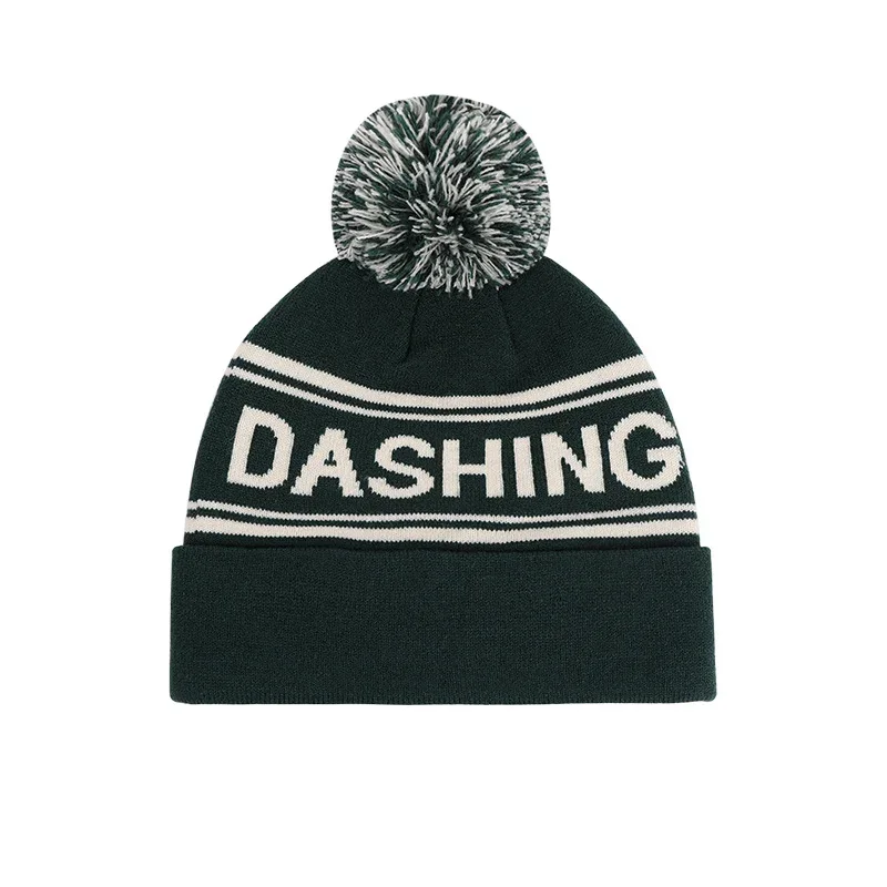 Green knitted pom-pom beanie with contrasting lettering