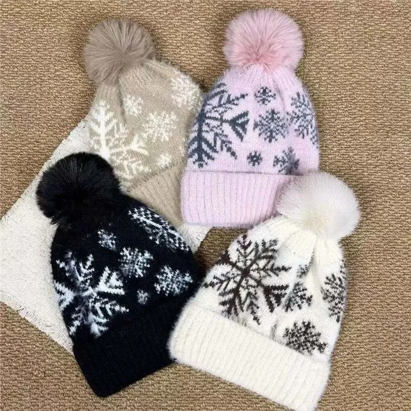 Four snowflake pattern pom pom beanies in taupe lilac black and cream