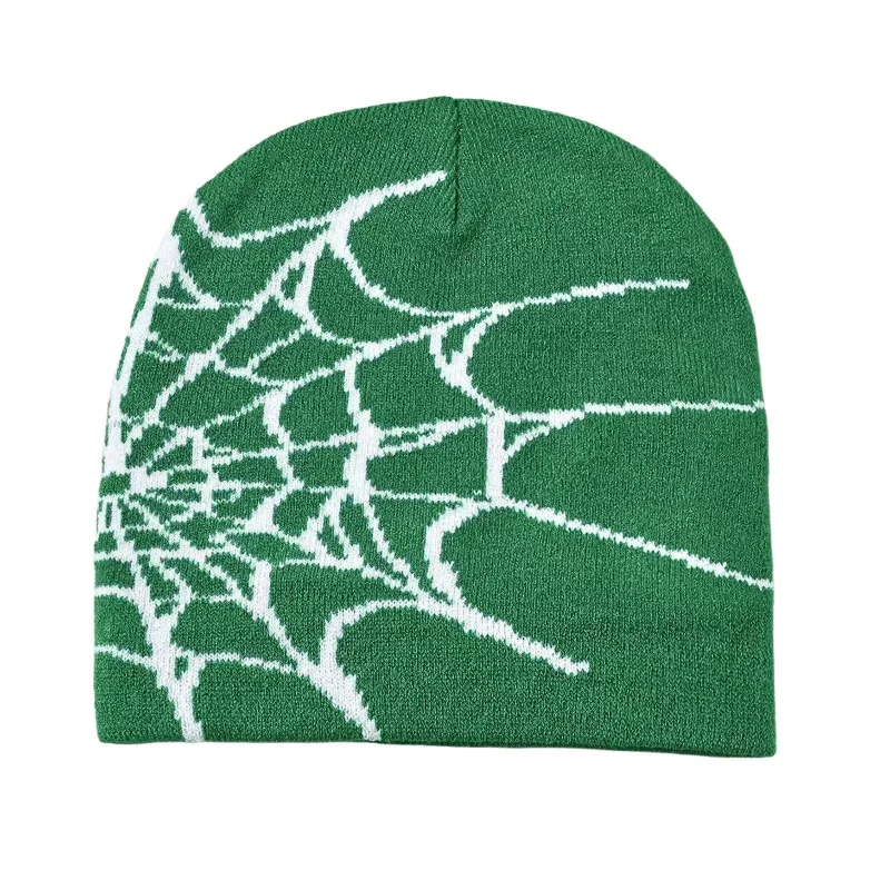 Green jacquard knit beanie showing contrasting white spiderweb graphics