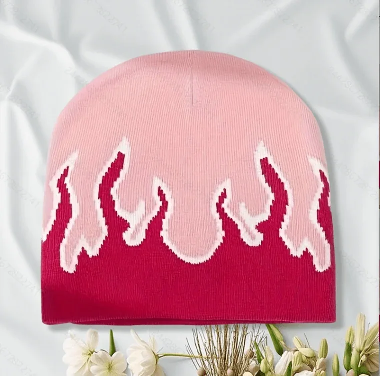Pink knit beanie with burgundy and cream flame motifs