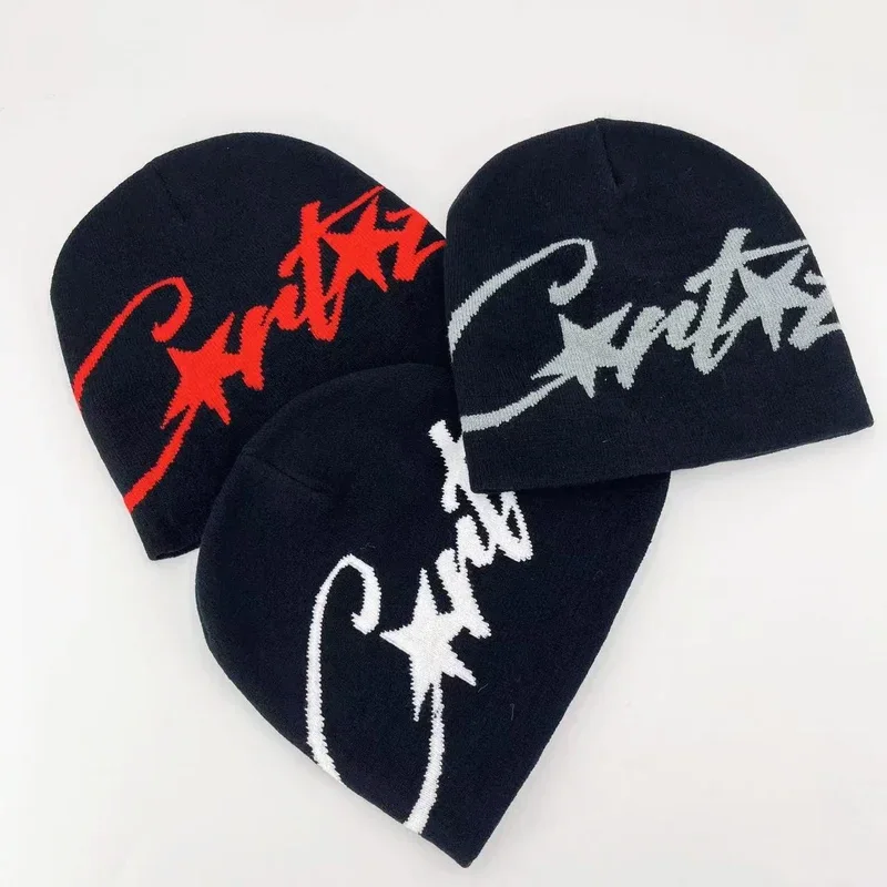 Three dark knit beanies with contrasting script lettering