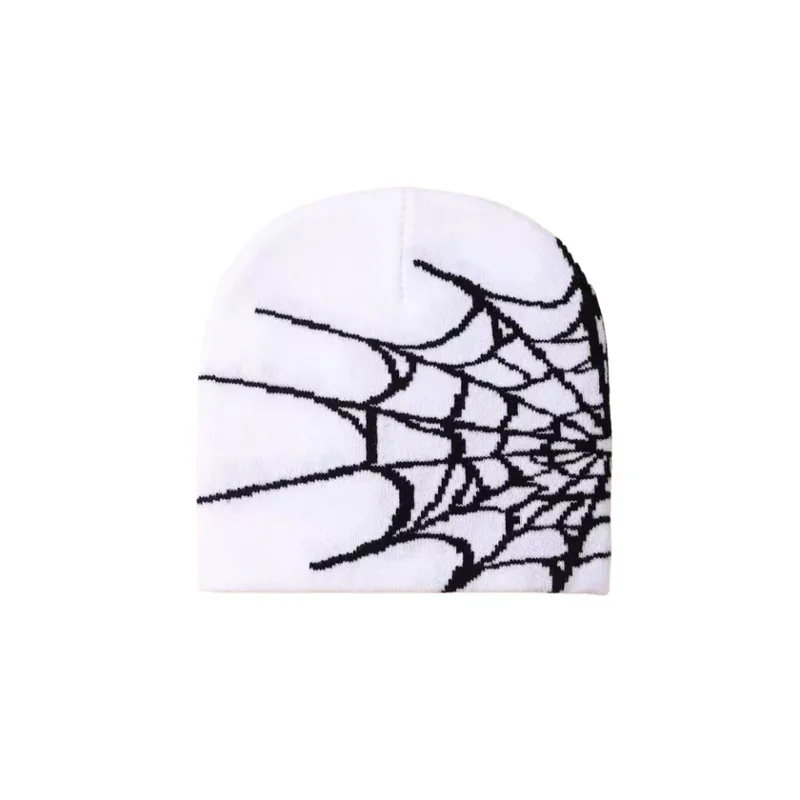 White knit beanie with a black spiderweb motif
